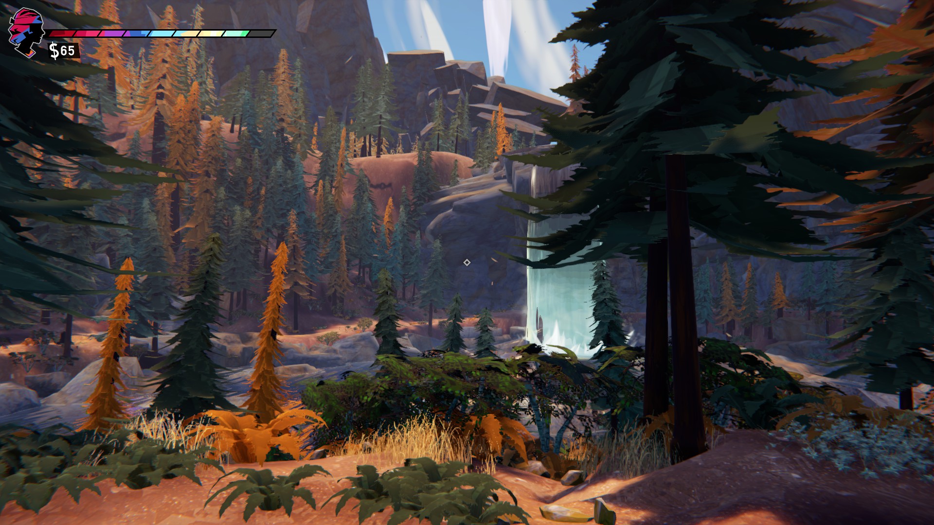 A small lake between reddish cliffs. With pine trees and other vegetation surrounding the lake. There is a small waterfall on the other side partially hidden by the trees.