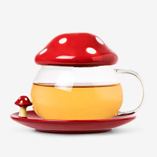 My new glass mug. It looks like a toadstool. There is also a little toadstool on its saucer.