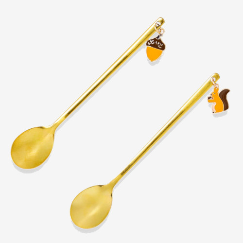 Two long spoons. One with acorn pattern and one with a squirrel.
